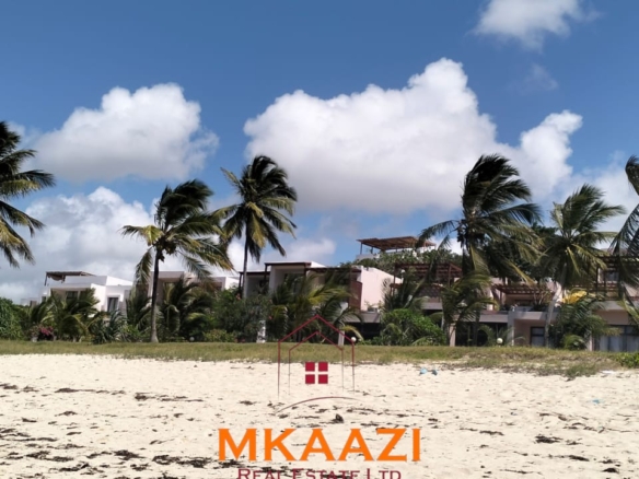 Luxury 3-bedroom beachfront villa for short-term rental in Kuruwitu, Vipingo with ocean views, private beach access, shared swimming pool, and modern interiors.