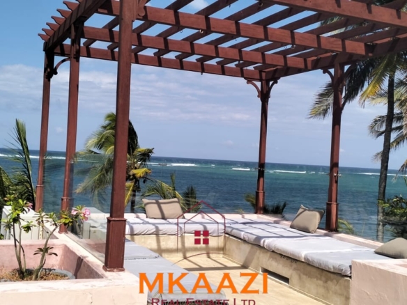 Luxury 3-bedroom beachfront villa for short-term rental in Kuruwitu, Vipingo with ocean views, private beach access, shared swimming pool, and modern interiors.
