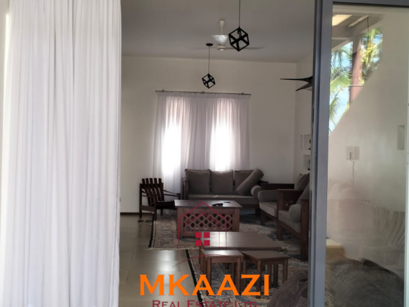 Luxury 3-bedroom beachfront villa for short-term rental in Kuruwitu, Vipingo with ocean views, private beach access, shared swimming pool, and modern interiors.