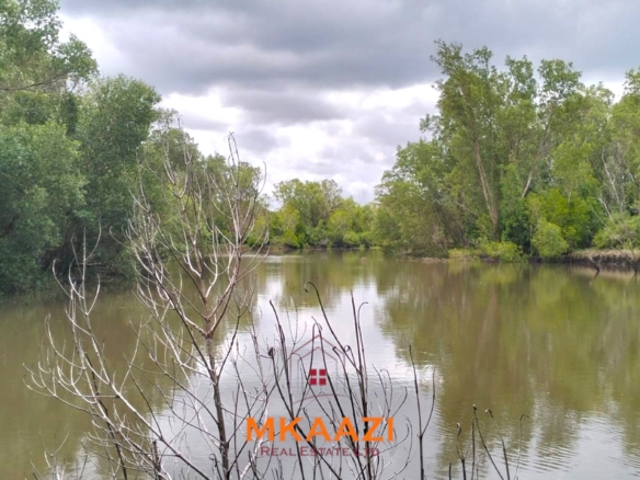 26,000 acres of prime land for sale in Lamu County, touching the LAPSET road connecting Lamu Port to Garissa, with a creek and mature mangrove forest. Asking KSh 230,000 per acre.