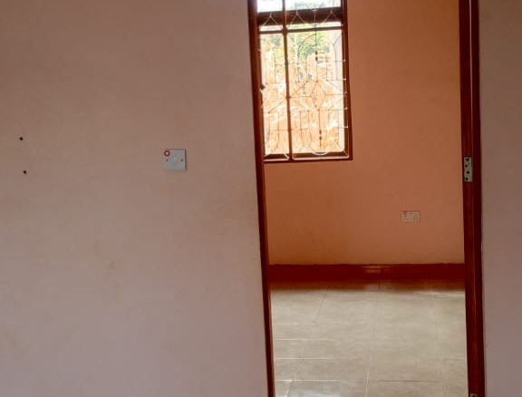 3-acre developed farm for sale in Kimashuku Mnadani, Moshi, Tanzania, featuring a farmhouse, 140-metre borehole, greenhouse, 200 apple trees, fruit trees and 5,000-litre water tank.