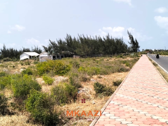 Prime 1-acre freehold road-frontage land for sale on Kanani Road in Watamu, Kilifi County.