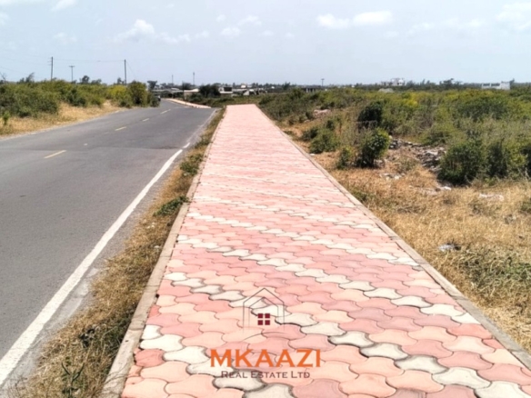 Prime 1-acre freehold road-frontage land for sale on Kanani Road in Watamu, Kilifi County.