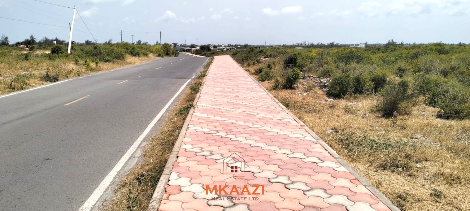 Prime 1-acre freehold road-frontage land for sale on Kanani Road in Watamu, Kilifi County.