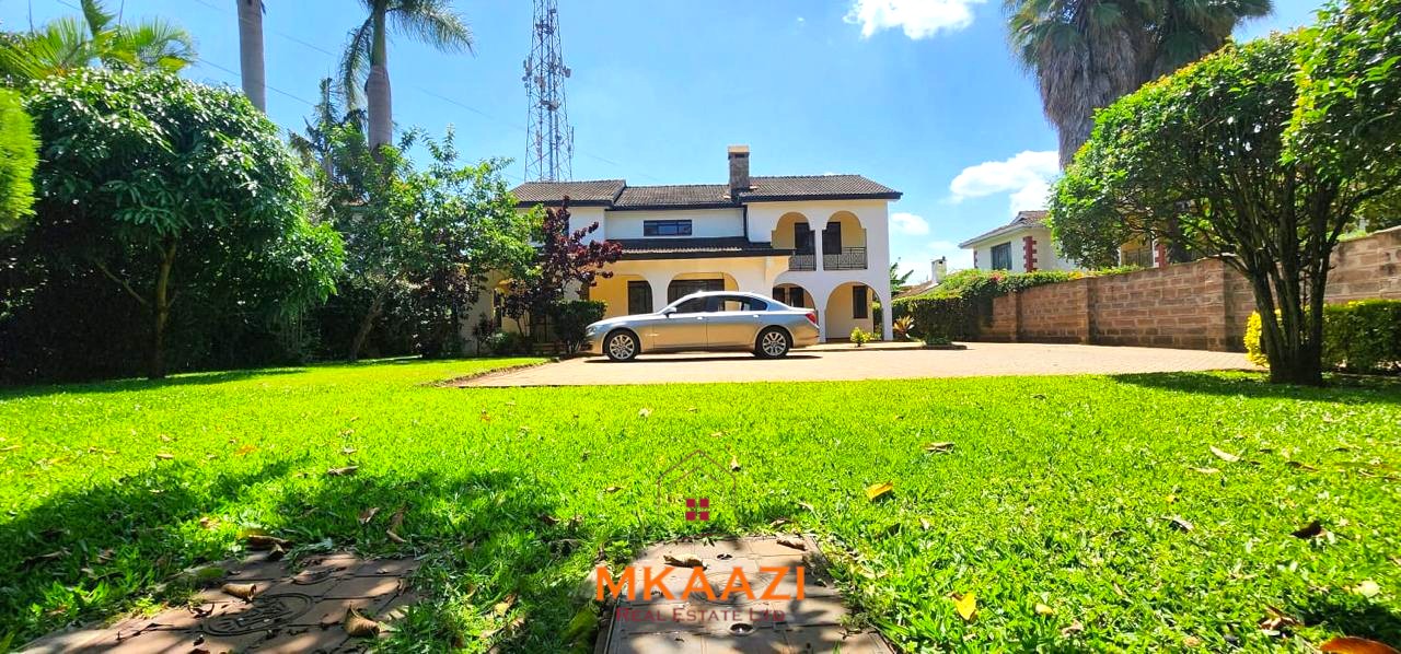 Spacious five-bedroom family home for sale on approximately a quarter acre in Mountain View, Nairobi, featuring a landscaped garden, renovated kitchen, fireplaces, and detached two-bedroom DSQ.