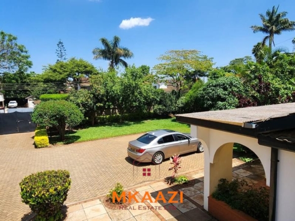 Spacious five-bedroom family home for sale on approximately a quarter acre in Mountain View, Nairobi, featuring a landscaped garden, renovated kitchen, fireplaces, and detached two-bedroom DSQ.