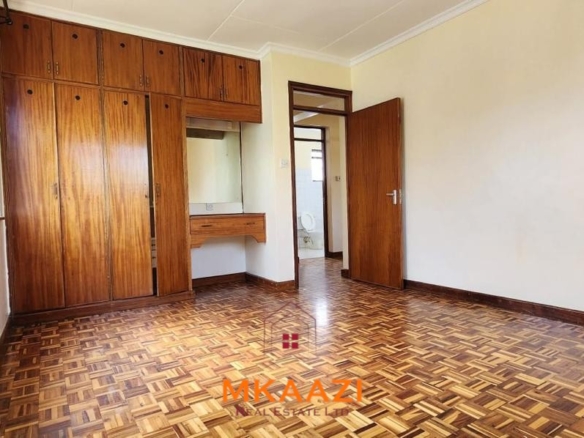 Spacious five-bedroom family home for sale on approximately a quarter acre in Mountain View, Nairobi, featuring a landscaped garden, renovated kitchen, fireplaces, and detached two-bedroom DSQ.