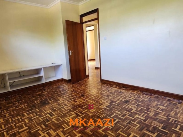 Spacious five-bedroom family home for sale on approximately a quarter acre in Mountain View, Nairobi, featuring a landscaped garden, renovated kitchen, fireplaces, and detached two-bedroom DSQ.