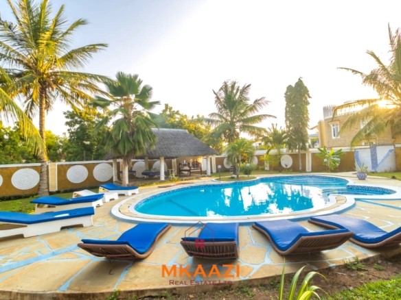 Fully furnished five-bedroom holiday home for sale in Diani on half an acre, featuring a private swimming pool and convenient access to Ukunda and the airstrip.