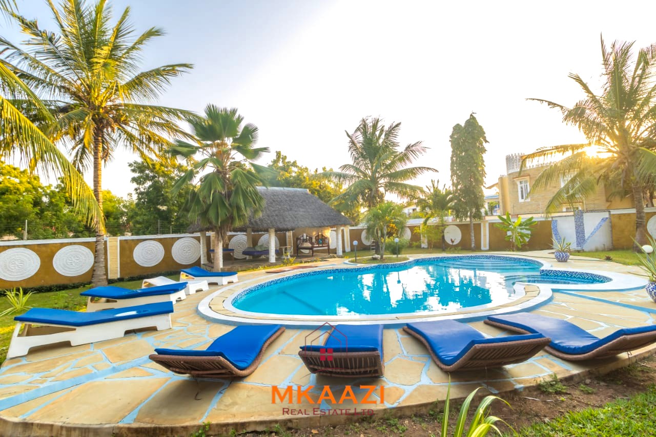 Fully furnished five-bedroom holiday home for sale in Diani on half an acre, featuring a private swimming pool and convenient access to Ukunda and the airstrip.