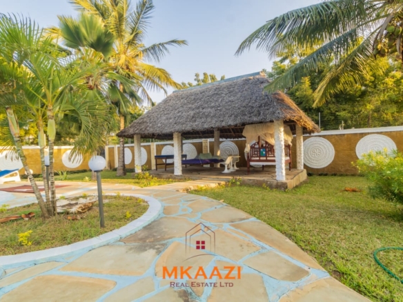 Fully furnished five-bedroom holiday home for sale in Diani on half an acre, featuring a private swimming pool and convenient access to Ukunda and the airstrip.