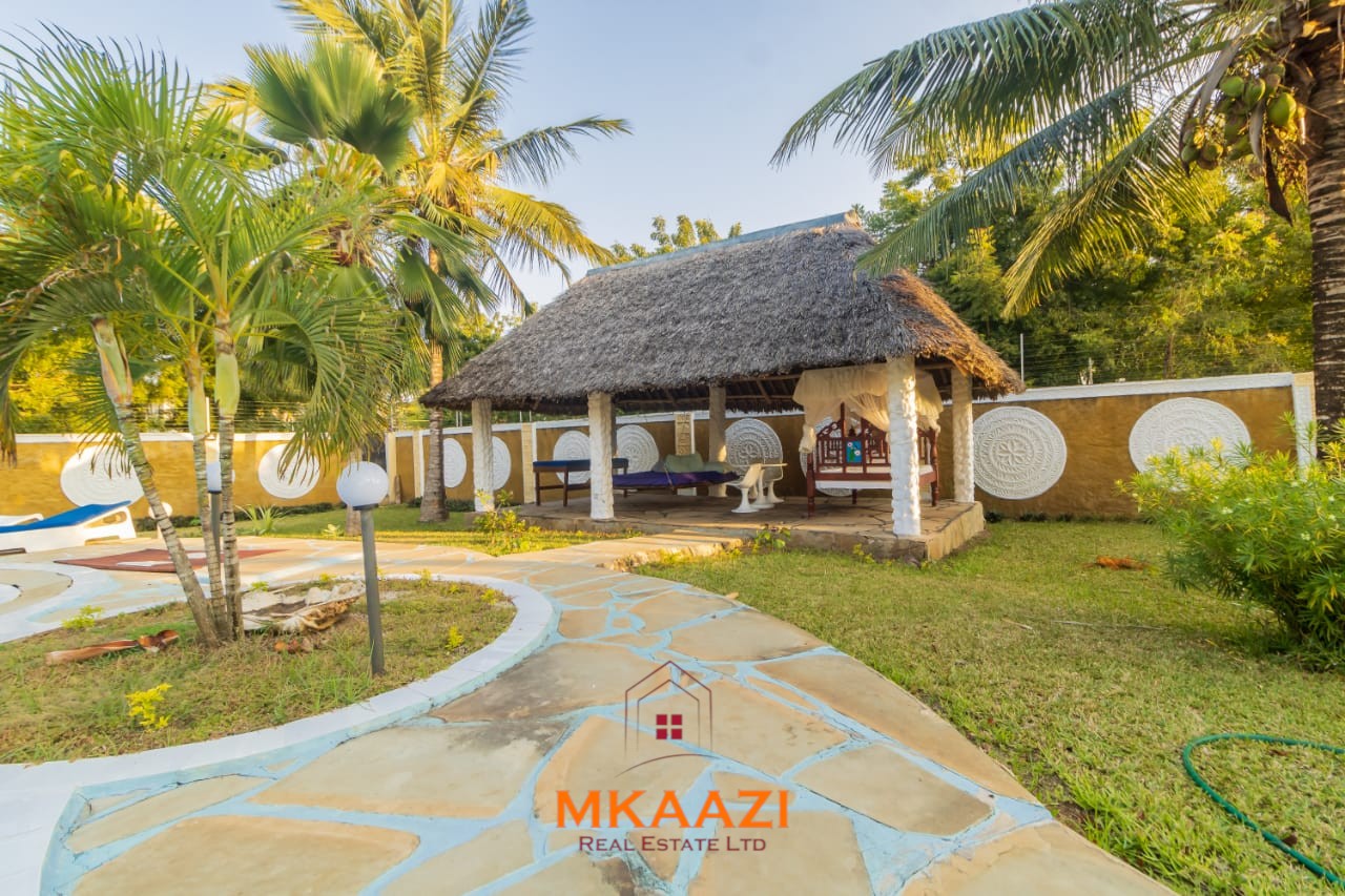 Fully furnished five-bedroom holiday home for sale in Diani on half an acre, featuring a private swimming pool and convenient access to Ukunda and the airstrip.