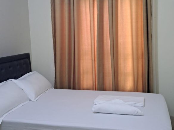 Fully furnished 3-bedroom ground-floor apartment for sale at Palm Ridge, Vipingo, featuring two bathrooms, swimming pool, green parks, parking, and 24/7 security.