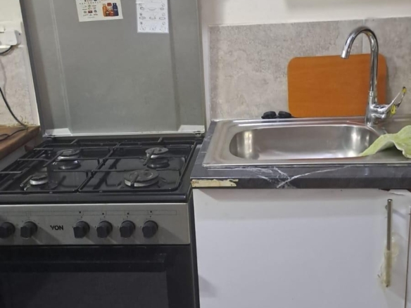 Fully furnished 3-bedroom ground-floor apartment for sale at Palm Ridge, Vipingo, featuring two bathrooms, swimming pool, green parks, parking, and 24/7 security.