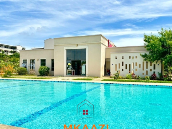 Fully furnished 3-bedroom ground-floor apartment for sale at Palm Ridge, Vipingo, featuring two bathrooms, swimming pool, green parks, parking, and 24/7 security.