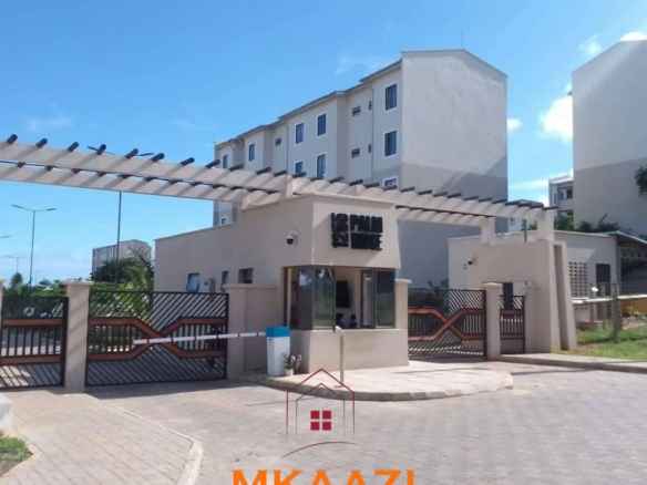 Fully furnished 3-bedroom ground-floor apartment for sale at Palm Ridge, Vipingo, featuring two bathrooms, swimming pool, green parks, parking, and 24/7 security.