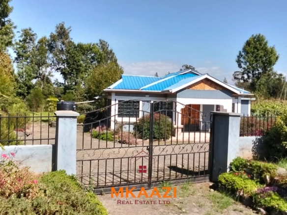 3.5-acre farm for sale in Ol Kalou with a 2-bedroom farmhouse, KPLC electricity, 70-foot fresh-water well and staff quarters.