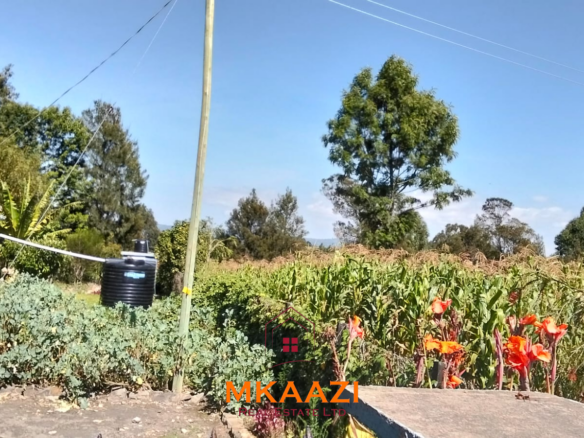 3.5-acre farm for sale in Ol Kalou with a 2-bedroom farmhouse, KPLC electricity, 70-foot fresh-water well and staff quarters.