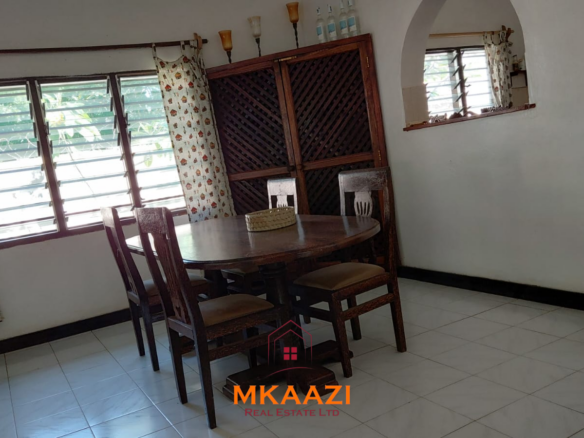 Half-acre property for sale off Kanani Road in Watamu with a 2-bedroom house, 1-bedroom SQ and three unfinished rental units near Watamu Mall.