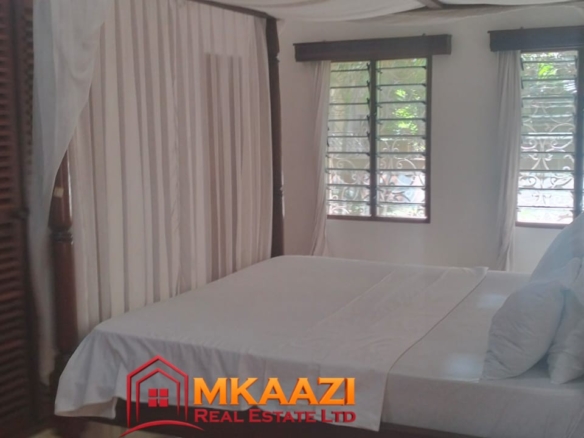 Comfortable second bedroom in a fully furnished 2-bedroom apartment for rent.