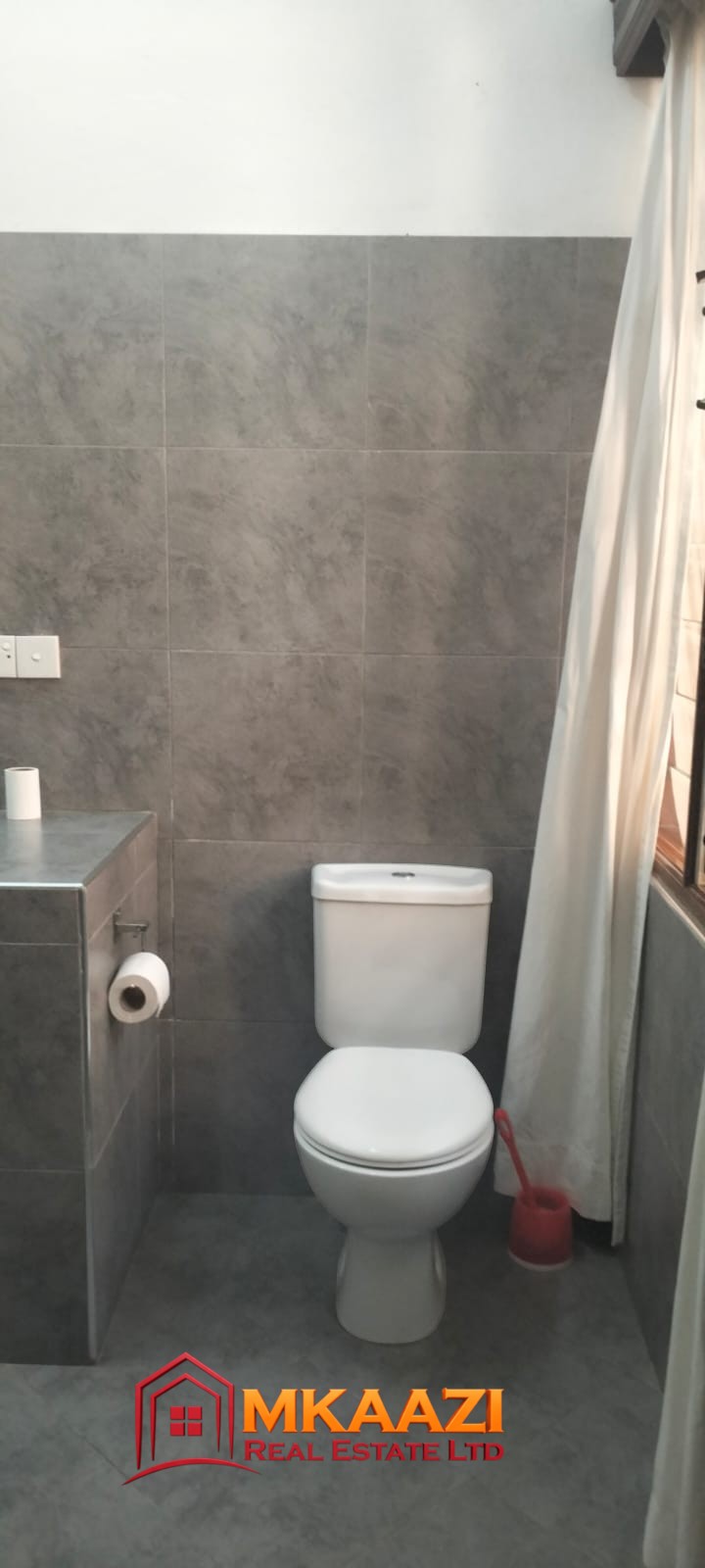 Mango Plaza 1br (6) Contemporary bathroom fittings in a modern 2-bedroom apartment available for short- and long-term rental.