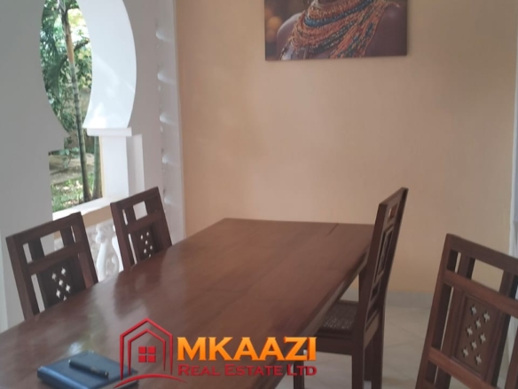 Outdoor living room at a furnished apartment in Casuarina Malindi