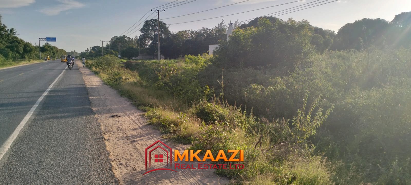 2-acre plot for sale on Malindi Road, Msabaha with tarmac frontage, mature trees, power on site and freehold title