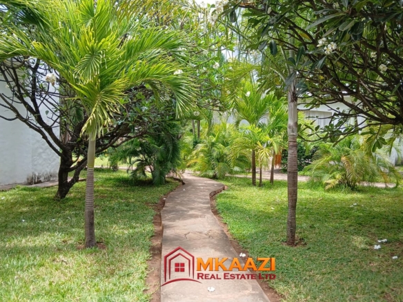 Three-bedroom furnished apartment with children's play area and walking trails
