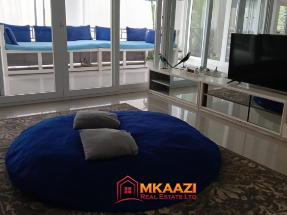 Green Malindi Luxury Apartments with balcony and outdoor sitting area